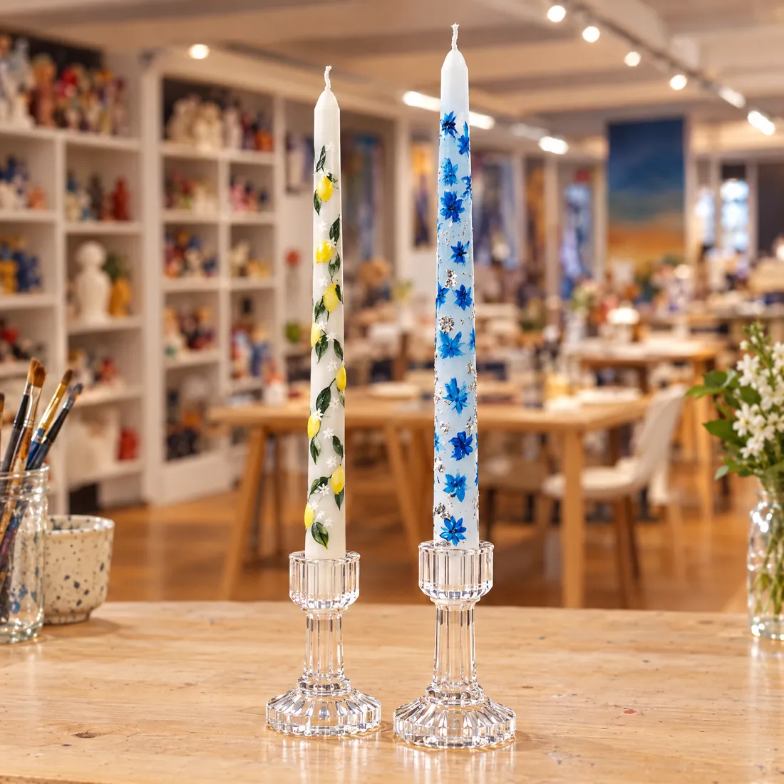 Floral painted taper candles on glass holders
